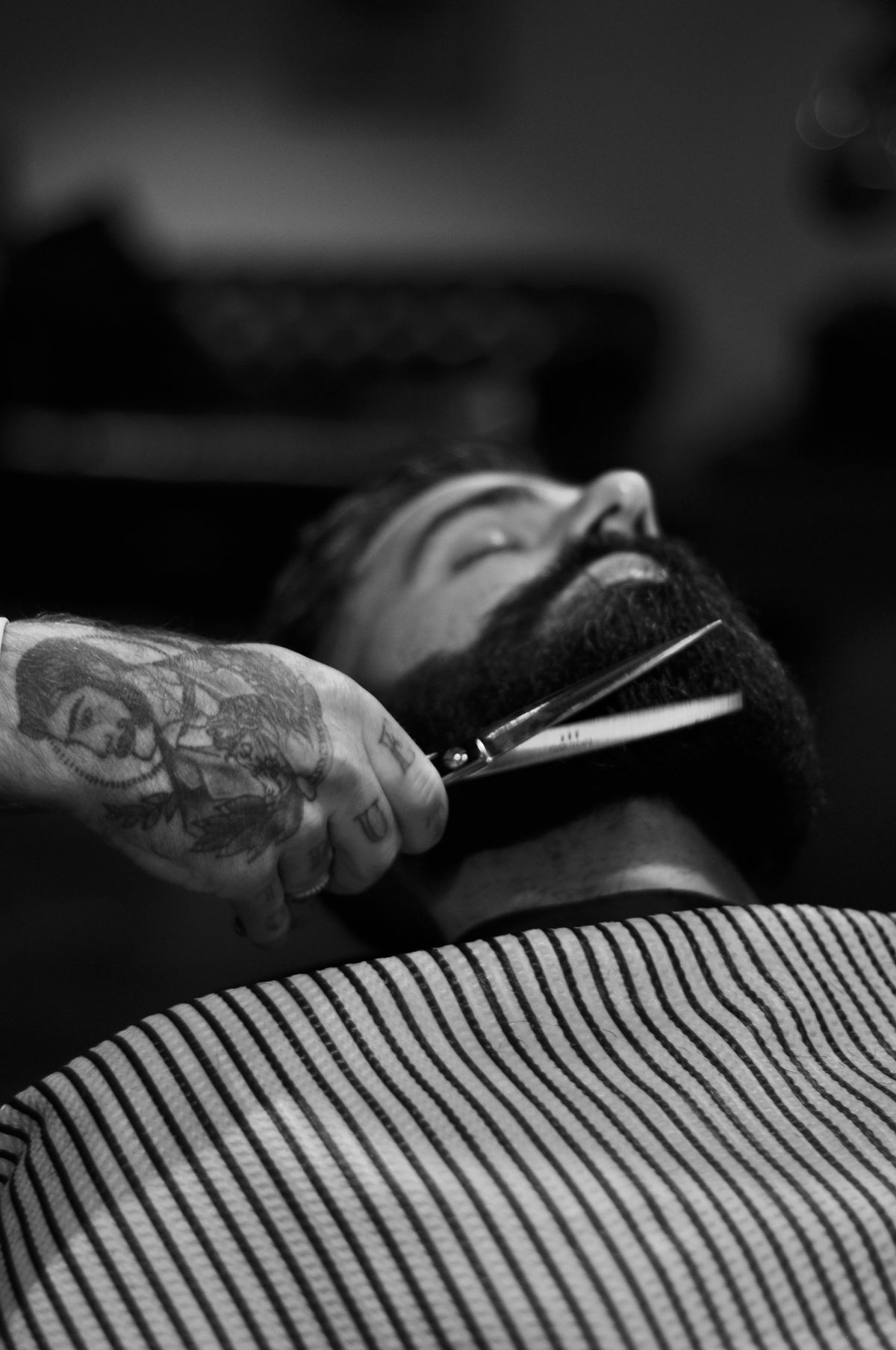 Scissor work on a beard, shot close